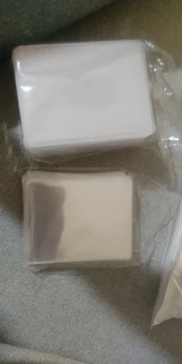 Buyer photo of two sealed packs of card protection
